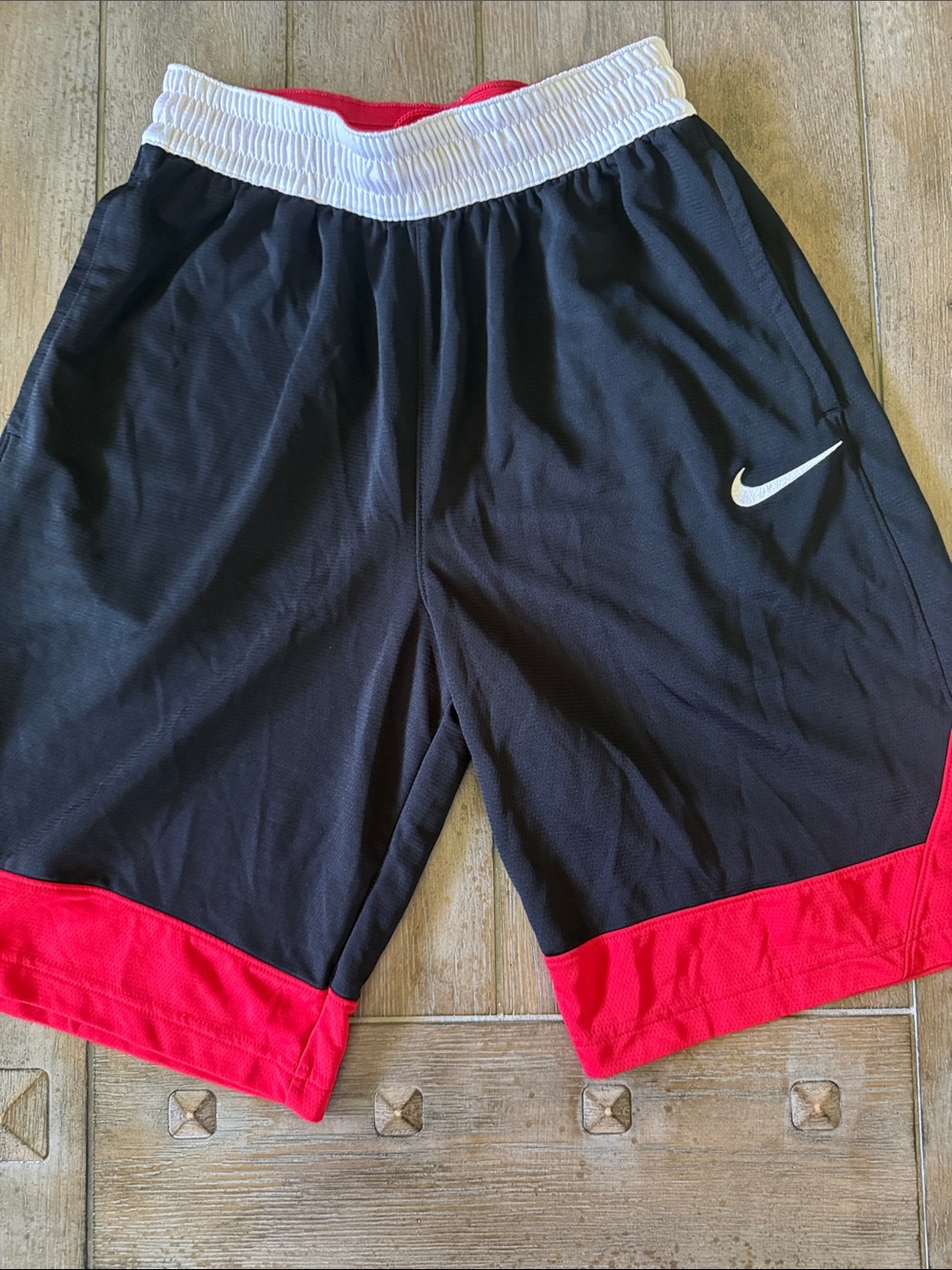 Nike Black Athletic Shorts with Red Hem and White Waistband
